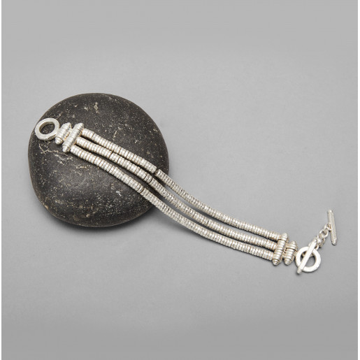 Brazalete Tres líneas de...
