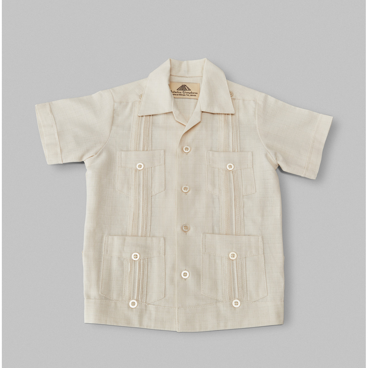 Toddler Guayabera Cream-Colored 60 years reference of the author's craft in Mexico now available online.